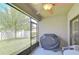 Relaxing screened patio featuring a ceiling fan and backyard views at 2723 Garden Falls Dr, Brandon, FL 33511