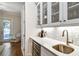 Stylish bar area features a wine fridge, sink, and seamless access to the outdoor space at 3109 W Granada St, Tampa, FL 33629