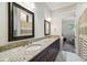 Bathroom showcasing double sinks with granite countertops and modern fixtures at 3109 W Granada St, Tampa, FL 33629