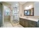 Elegant bathroom showcasing a glass-enclosed shower and a modern vanity with ample storage at 3109 W Granada St, Tampa, FL 33629