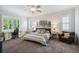 Bright bedroom with a ceiling fan, desk, and comfortable seating area, perfect for relaxation at 3109 W Granada St, Tampa, FL 33629