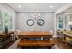 Dining room with hardwood floors and large windows bringing in natural light at 3109 W Granada St, Tampa, FL 33629