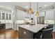 Gourmet kitchen showcasing an island with seating, stainless appliances, and custom cabinetry at 3109 W Granada St, Tampa, FL 33629
