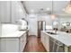 Modern kitchen featuring white cabinets, stainless steel appliances, and marble countertops at 3109 W Granada St, Tampa, FL 33629