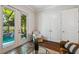 Bright sitting area with pool view and access, featuring hardwood floors and closet for extra storage at 3109 W Granada St, Tampa, FL 33629