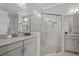 Bright bathroom featuring a glass-enclosed shower and granite countertops at 3161 Satilla Loop, Odessa, FL 33556