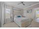 Comfortable bedroom with large window, neutral decor, and stylish furniture at 3161 Satilla Loop, Odessa, FL 33556