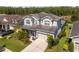 Charming two-story home boasts manicured lawn, mature plantings and attached two car garage at 3161 Satilla Loop, Odessa, FL 33556