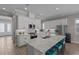 Modern kitchen with stainless steel appliances, granite countertops, and a large island at 3161 Satilla Loop, Odessa, FL 33556
