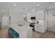 Bright kitchen with white cabinetry, granite island and breakfast bar at 3161 Satilla Loop, Odessa, FL 33556