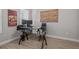 Well-lit home office with a glass desk and contemporary decor at 3161 Satilla Loop, Odessa, FL 33556
