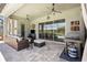 Inviting covered patio with outdoor seating, ceiling fans, and a view of the pool at 3161 Satilla Loop, Odessa, FL 33556