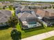 Backyard boasts screened pool, well-manicured lawn with lush landscaping in quiet community at 3161 Satilla Loop, Odessa, FL 33556