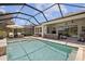 Relaxing pool with outdoor seating, screened-in enclosure and view of the house at 3161 Satilla Loop, Odessa, FL 33556