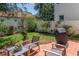 Well manicured backyard with pavers, grill, white fencing and garden at 3412 W San Juan St # B, Tampa, FL 33629