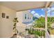 View from the balcony showcases neighborhood homes and lush foliage at 3412 W San Juan St # B, Tampa, FL 33629