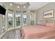 Light filled bedroom featuring bay windows and a quaint sitting area at 3412 W San Juan St # B, Tampa, FL 33629