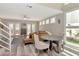 Bright living room with french doors, hardwood floors, and modern staircase at 3412 W San Juan St # B, Tampa, FL 33629