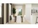 Open-concept dining area showcases a wooden table, white chairs, and bright natural light at 36068 Risa Michele St, Zephyrhills, FL 33541