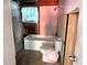 Bathroom with a tub and toilet, ready for a renovation project to bring it to its full potential at 3706 N 36Th St, Tampa, FL 33610