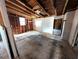 Interior space with exposed beam ceiling, primed for complete renovation and personalization at 3706 N 36Th St, Tampa, FL 33610