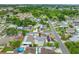 Aerial perspective of the house marked with a red arrow and the encompassing residential neighborhood at 3927 Spence Ave, Tampa, FL 33614