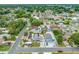 Aerial view of a residential neighborhood with the house marked by a red arrow at 3927 Spence Ave, Tampa, FL 33614