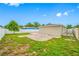 Spacious backyard showcasing a small tree and paved section, great for relaxing or entertaining at 3927 Spence Ave, Tampa, FL 33614