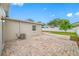 Paver patio in the backyard featuring a well-maintained yard with a privacy fence and a well-kept side yard at 3927 Spence Ave, Tampa, FL 33614