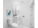 Clean and modern bathroom featuring a sleek vanity, decorative vase, modern mirror, and a toilet, creating a spa-like experience at 3927 Spence Ave, Tampa, FL 33614