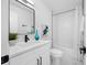Modern bathroom features white subway tile, a bathtub, and a sleek vanity at 3927 Spence Ave, Tampa, FL 33614