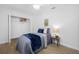 Cozy bedroom with a bed, ceiling fan, and closet at 3927 Spence Ave, Tampa, FL 33614