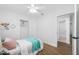Light-filled bedroom with an open closet and an en-suite bathroom at 3927 Spence Ave, Tampa, FL 33614