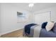 Bright bedroom with a window, ceiling fan, and a comfortable bed at 3927 Spence Ave, Tampa, FL 33614