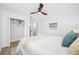 Inviting bedroom showcasing a ceiling fan, closet, area rug, and light-colored walls creating a peaceful retreat at 3927 Spence Ave, Tampa, FL 33614