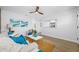Bright living room with a comfortable white sofa, blue accents, and a view to the kitchen at 3927 Spence Ave, Tampa, FL 33614