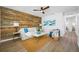 Stylish living room with a wood accent wall, modern furniture, and elegant decor at 3927 Spence Ave, Tampa, FL 33614