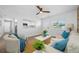 Cozy living room with white walls, modern decor, comfortable seating, and natural light at 3927 Spence Ave, Tampa, FL 33614