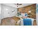 Inviting living room featuring a wood-paneled wall, comfortable seating, and a bright, airy atmosphere at 3927 Spence Ave, Tampa, FL 33614