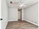 Spacious bedroom featuring wood-look flooring, a ceiling fan, and neutral walls at 39650 Us Highway 19 N # 143, Tarpon Springs, FL 34689