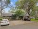 Charming home with a well-maintained yard and mature trees at 39650 Us Highway 19 N # 143, Tarpon Springs, FL 34689