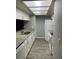 This modern kitchen features granite countertops and all-white appliances at 39650 Us Highway 19 N # 143, Tarpon Springs, FL 34689