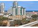 An aerial view highlighting an apartment complex with water views and a highway below at 400 4Th S Ave # 508, St Petersburg, FL 33701