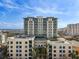 A front exterior view of condo buildings with palm trees, balconies and blue skies at 400 4Th S Ave # 508, St Petersburg, FL 33701