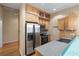 Bright kitchen with stainless steel appliances, wood cabinetry, and a large basin sink at 400 4Th S Ave # 508, St Petersburg, FL 33701