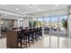 Modern kitchen with bar seating, stainless steel appliances, and access to a patio at 400 4Th S Ave # 508, St Petersburg, FL 33701