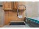 Close up on a stylish kitchen sink with a modern faucet and wood cabinetry at 400 4Th S Ave # 508, St Petersburg, FL 33701
