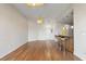 Open-concept living space features hardwood floors, breakfast bar seating and neutral paint at 400 4Th S Ave # 508, St Petersburg, FL 33701