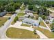 Spacious fenced yard with a paved driveway and a home nestled among mature trees at 4005 W Coachman Ave, Tampa, FL 33611