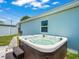 Backyard featuring a luxurious hot tub, perfect for relaxation and entertainment at 4005 W Coachman Ave, Tampa, FL 33611